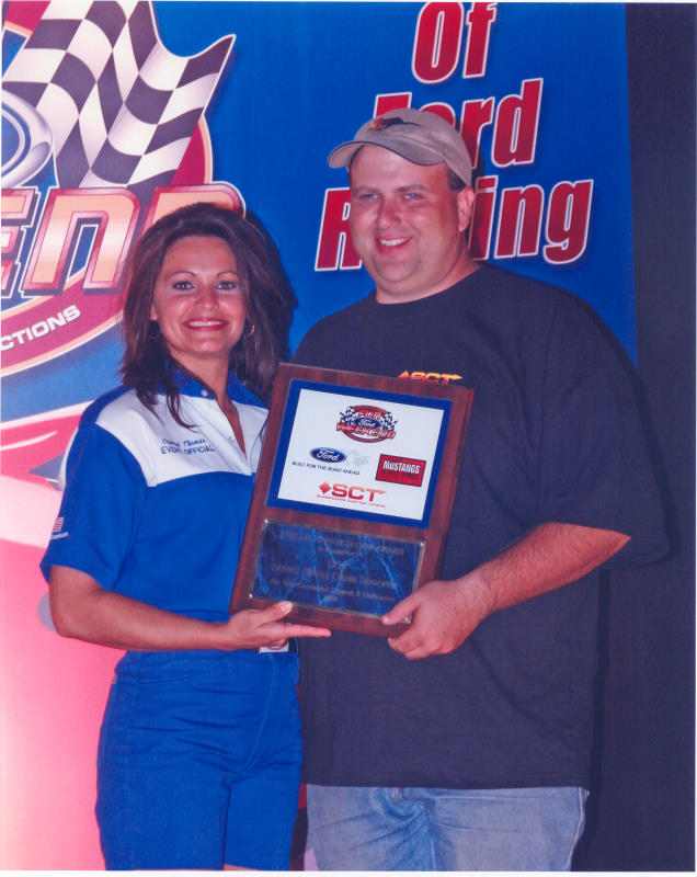 Tony Whetstone with championship plaque